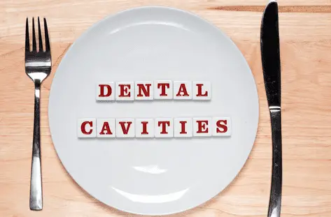 image of plate with words dental cavities on it