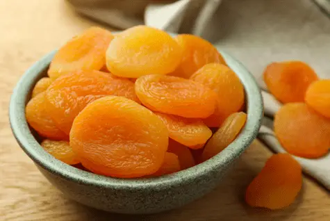 a bowl of dried apricots